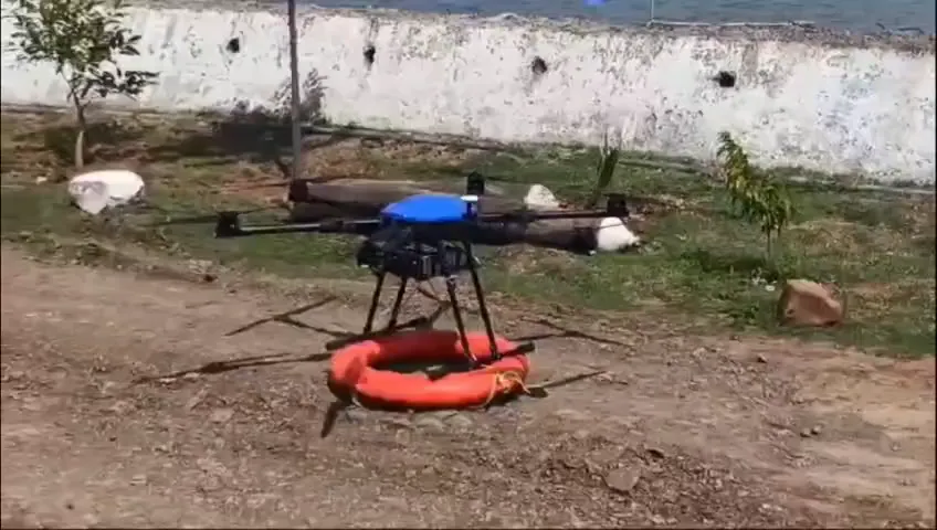 Rescue drone carrying an orange life ring